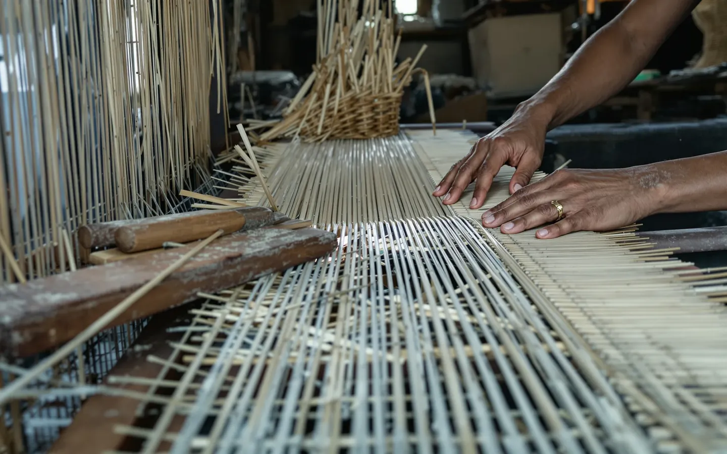 Rattan and abaca decor being woven in Cebu, rendered