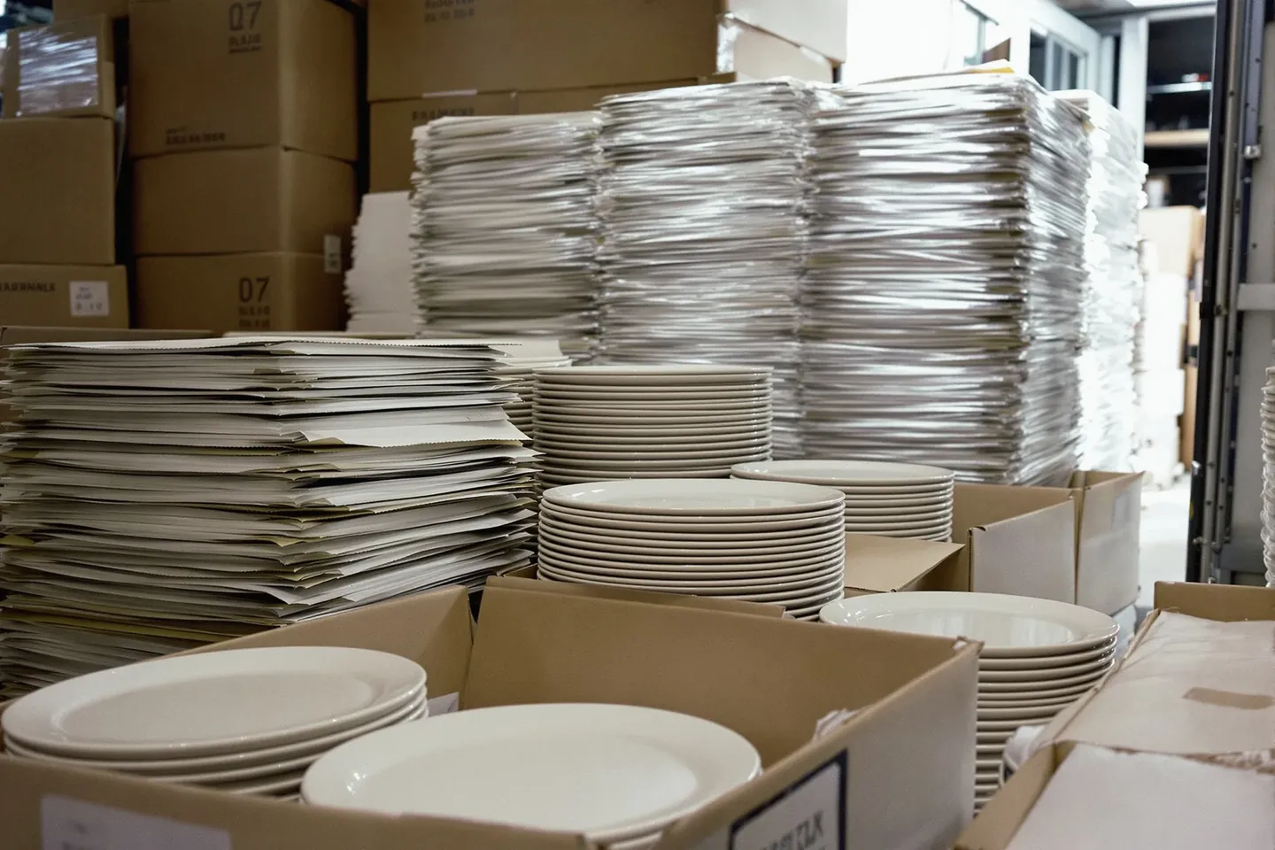 Plates stacked with paper between each one, packed for export