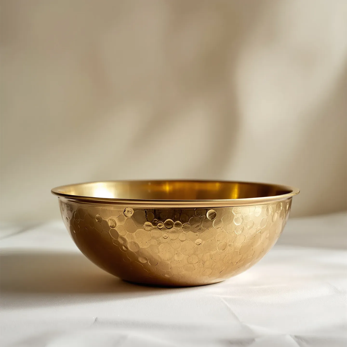 A hand-hammered solid brass serving bowl